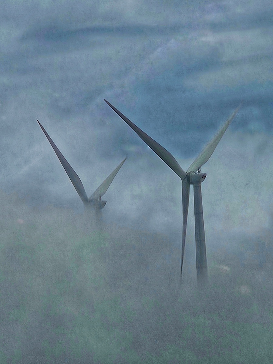 PEEKING THROUGH THE CLOUD